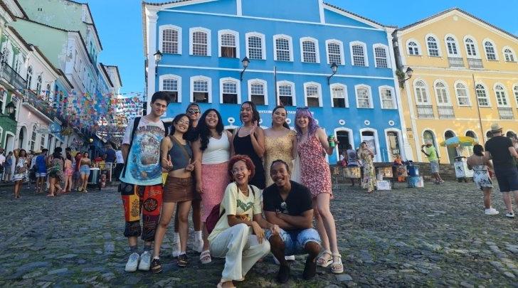 Photo of students in front of colorful buildings in Brazil